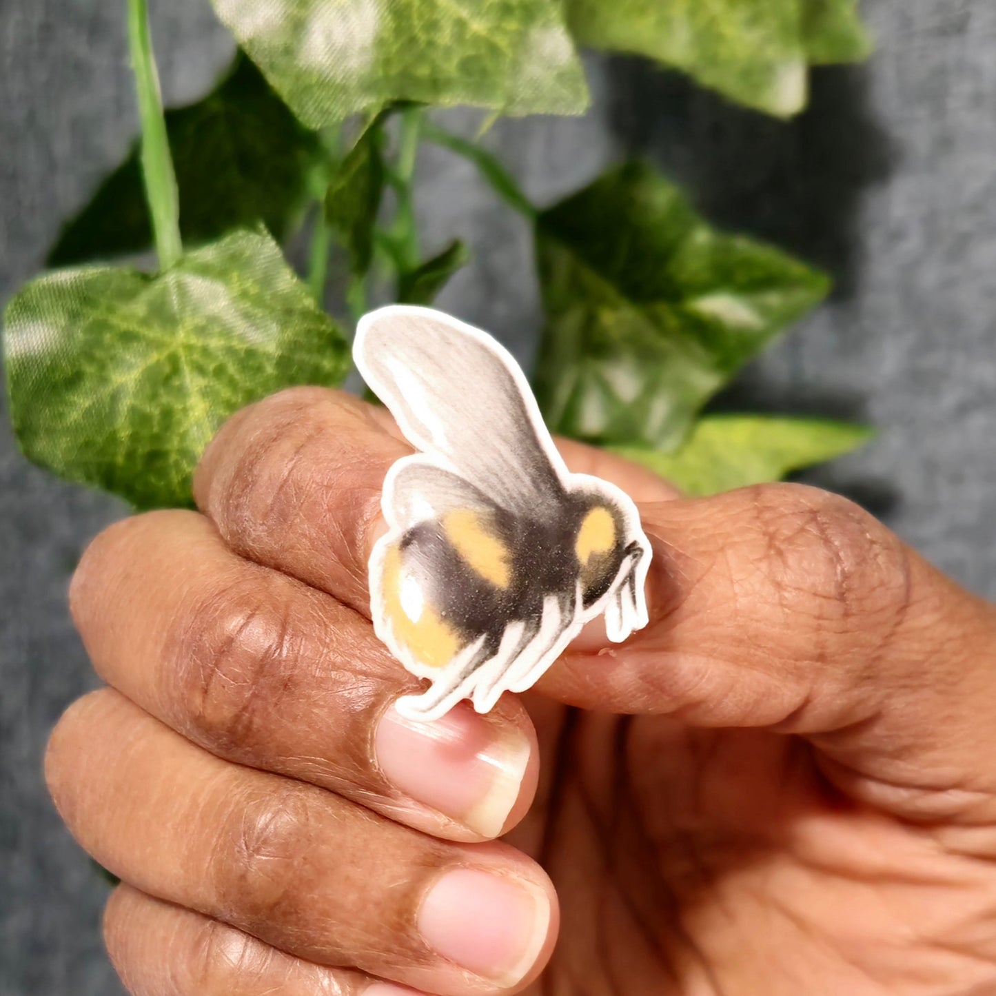 Handmade bumblebee resin badge pin featuring realistic bee artwork for jackets, bags and clothing