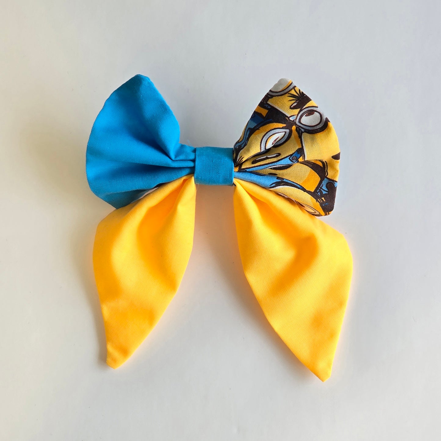 Handmade blue and yellow character-inspired hair bow