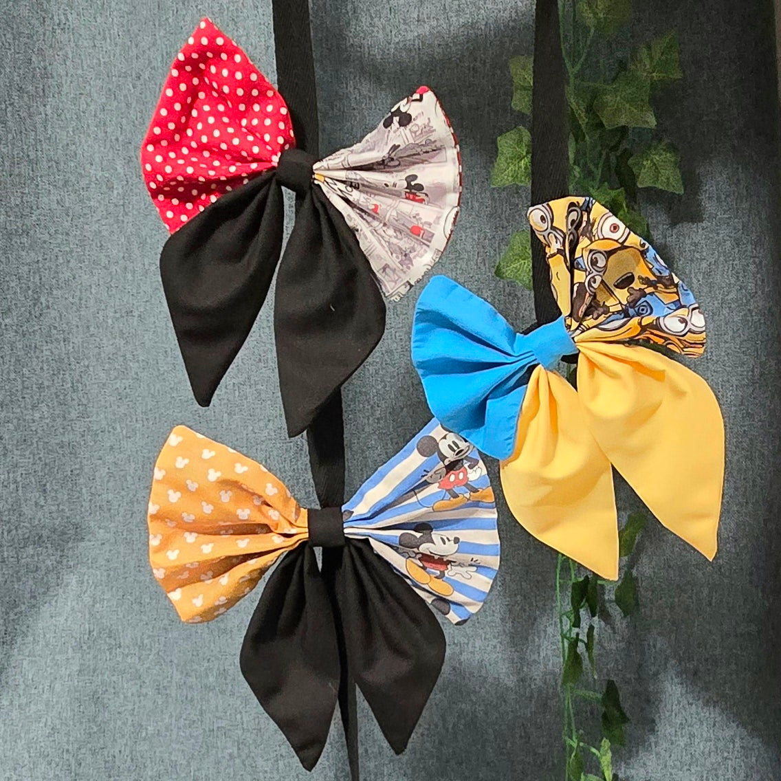 Handmade patchwork hair bows featuring coordinated character-inspired fabrics in three colourways