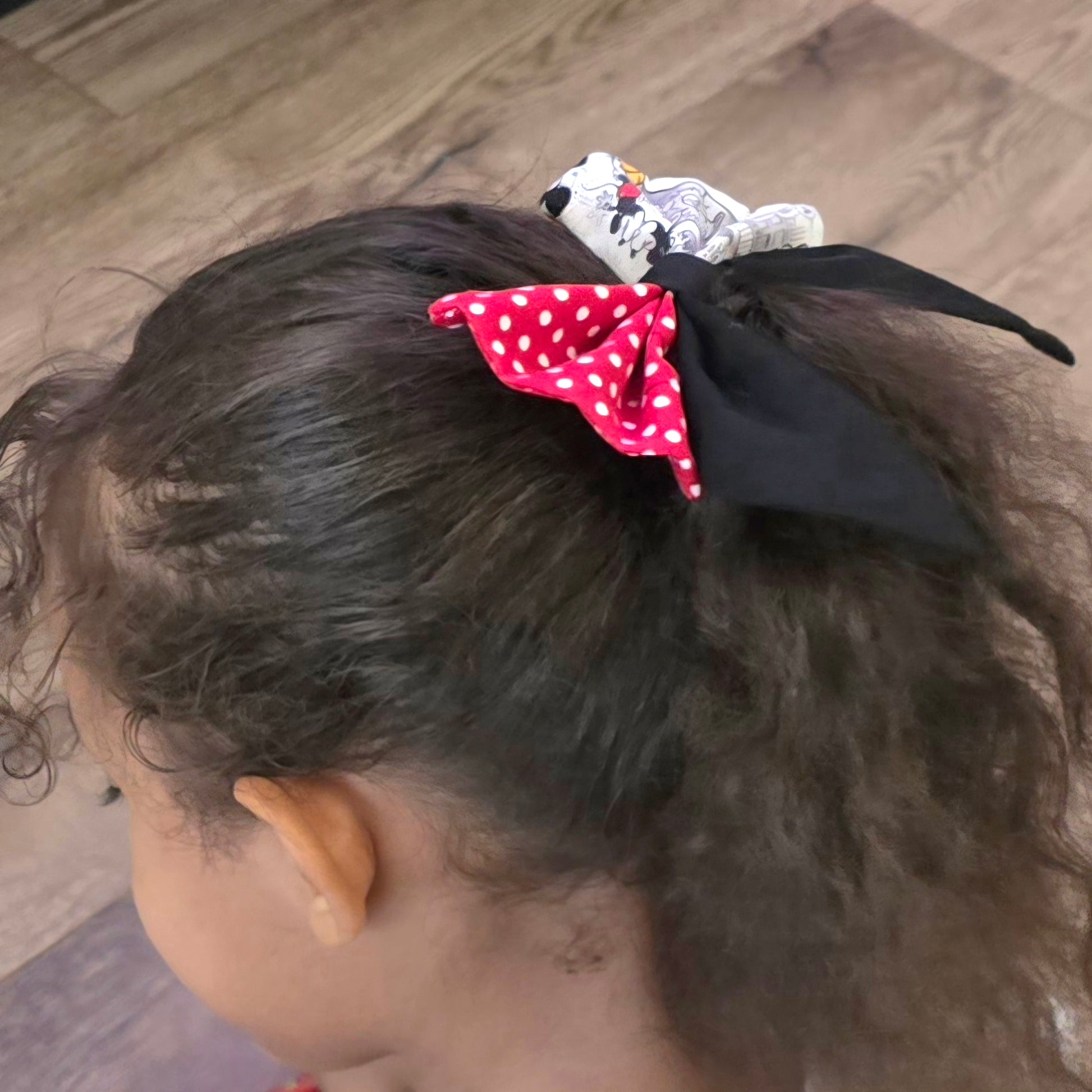 Small handmade character-inspired hair bow attached to a ponytail